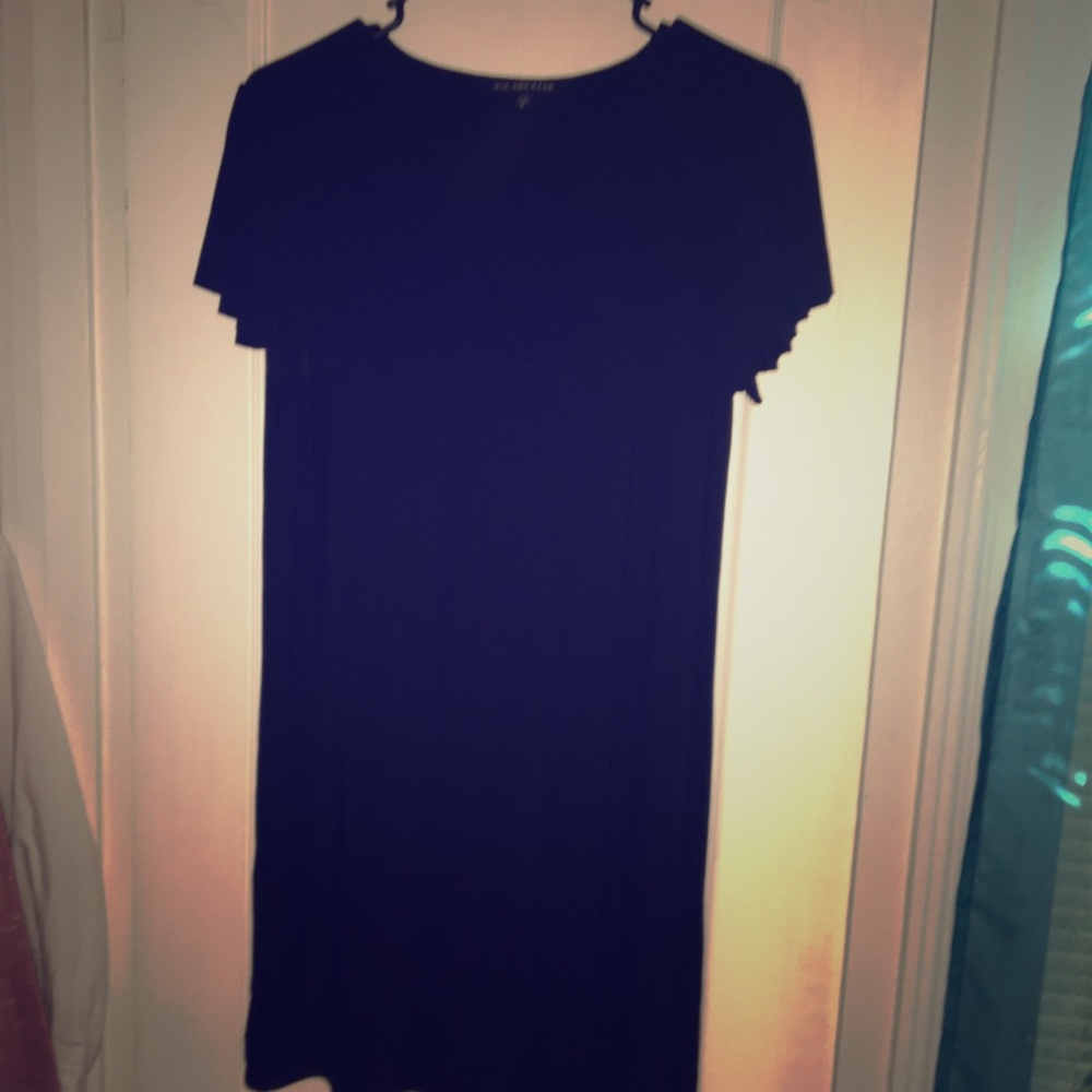Black knee length dress with flair arm thingy